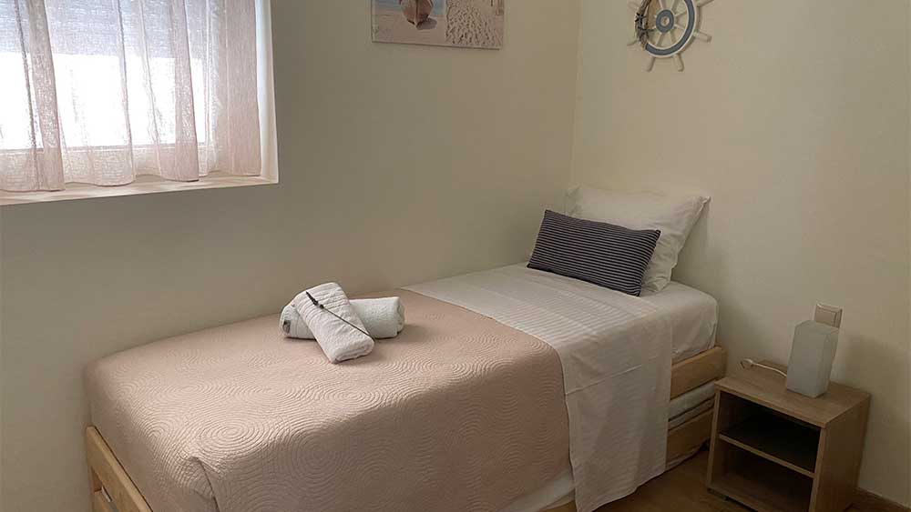 Bedroom with 2 beds downstairs Villa Tranquility in Sivota Greece